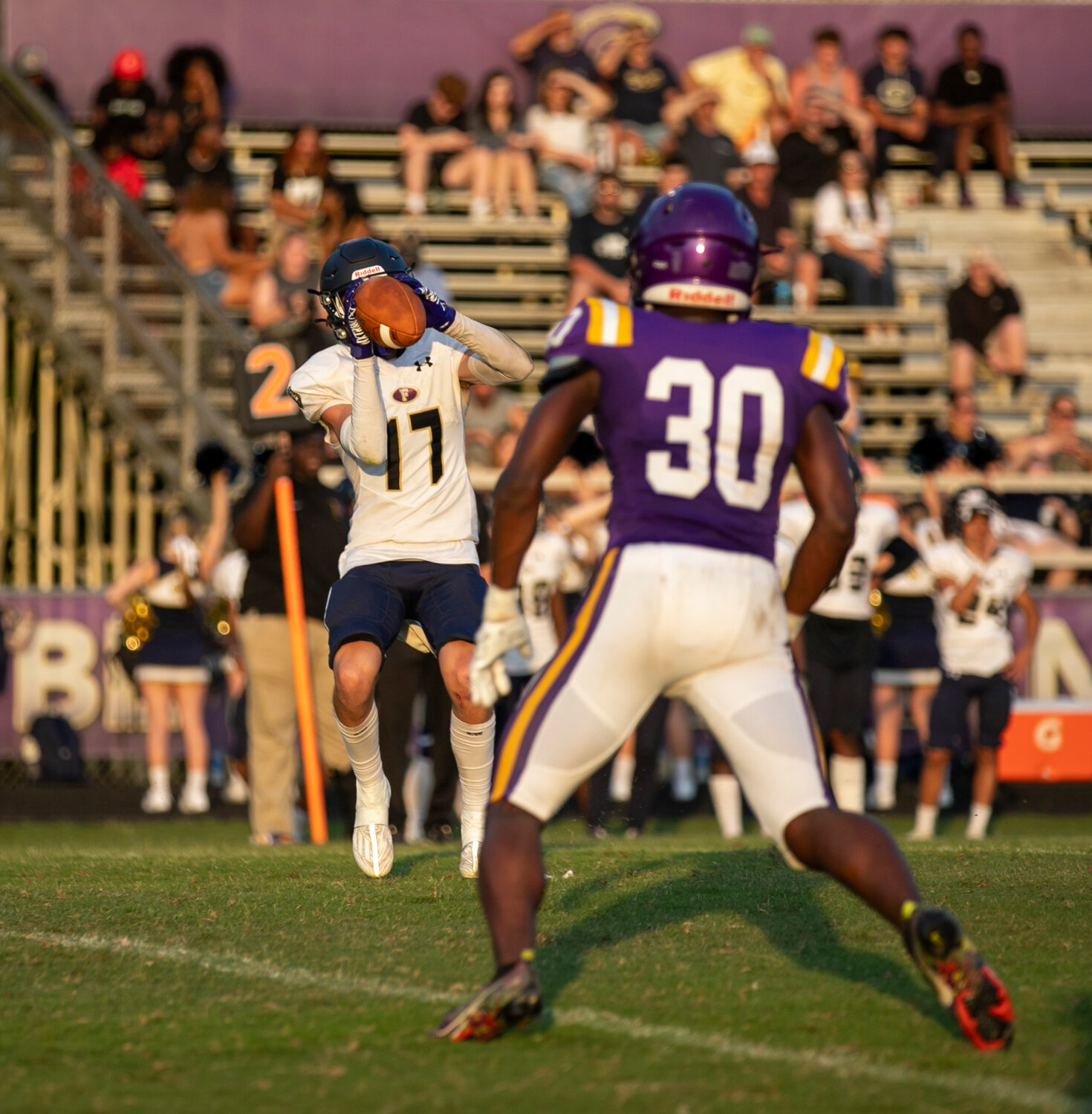 Lion rising junior Cooper Hermecz looks in one of his three catches on Foley’s second scoring drive Friday, May 19, against the Daphne Trojans at Jubilee Stadium.