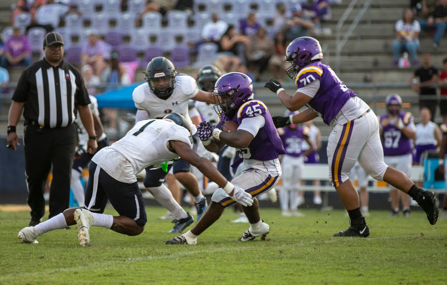 Perry Thompson comes up for a tackle on Nick Clark during spring game action between the Foley Lions and Daphne Trojans Friday, May 19, at Jubilee Stadium.