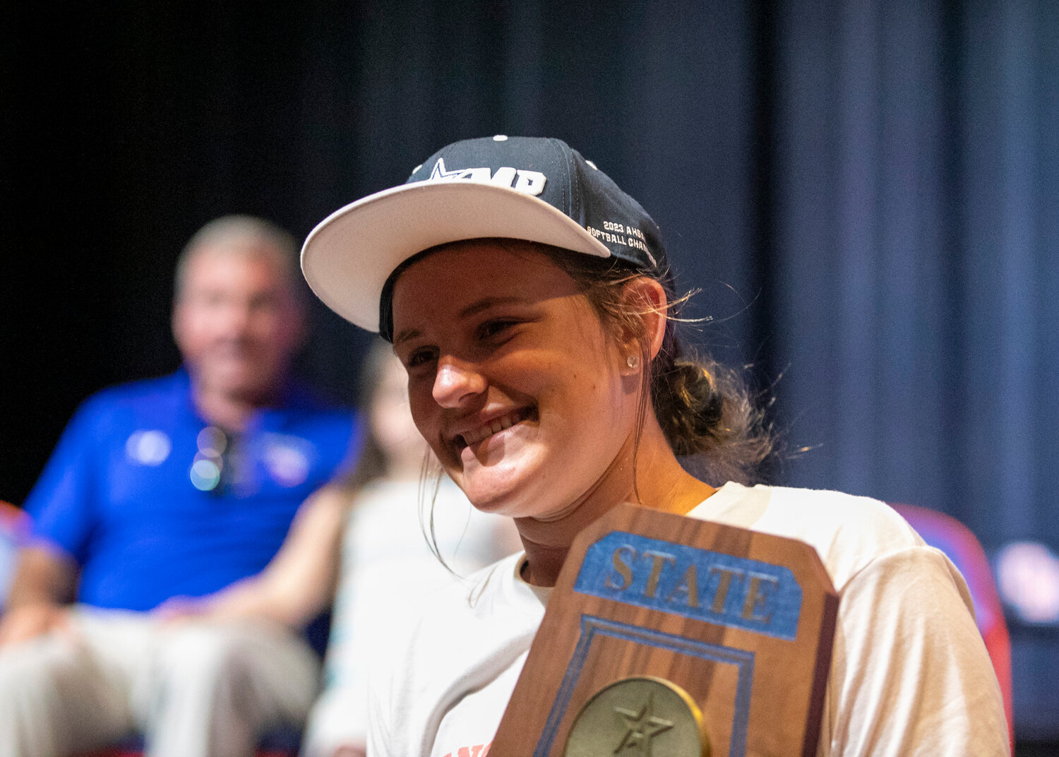 Mako freshman Ava Hodo poses with a Blue Map trophy during the welcoming ceremony Sunday, May 21, at the Orange Beach Performing Arts Center. Hodo has now been part of the Makos’ first three state championship seasons with three high school seasons remaining.