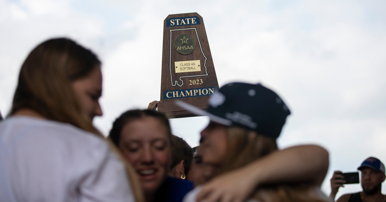 Orange Beach senior Georgia McDonald hoists the Blue Map trophy as the Makos returned home from the AHSAA state tournament Sunday, May 21. It marked Orange Beach’s third consecutive title and first as a city school system.