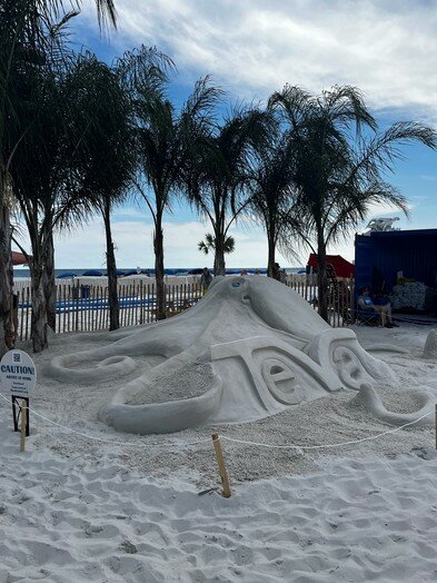 Janel Hawkins, owner of Sandcastle University, built several pieces of art on the beach during Hangout Music Festival.
