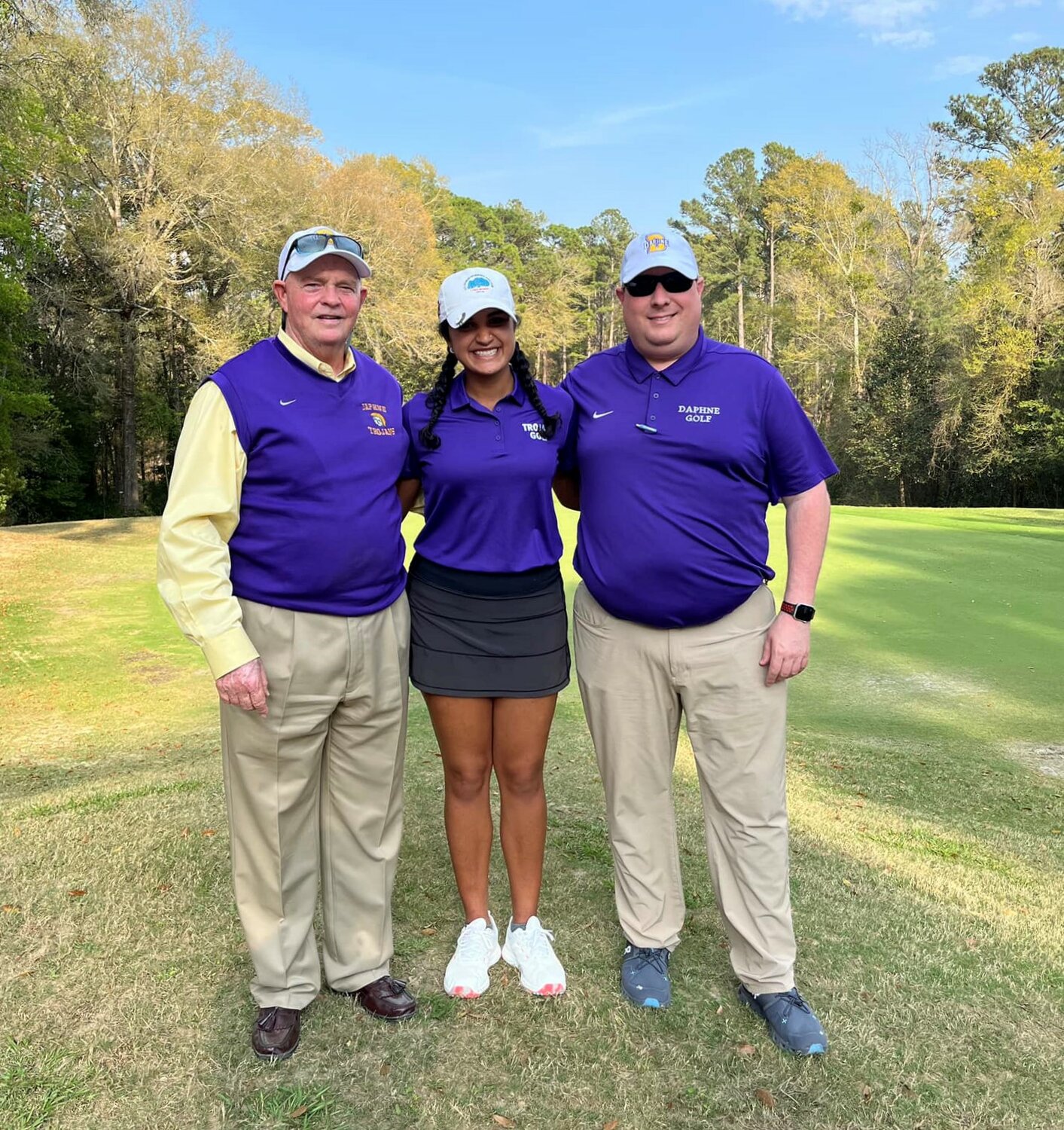 Daphne rising senior Samiya Bodalia poses for a picture with coaches Robert Guthrie and Dannie Mixon during a tournament in March. Bodalia will represent the Trojans this summer at the AHSAA North-South All-Star girls’ golf competition in Montgomery.
