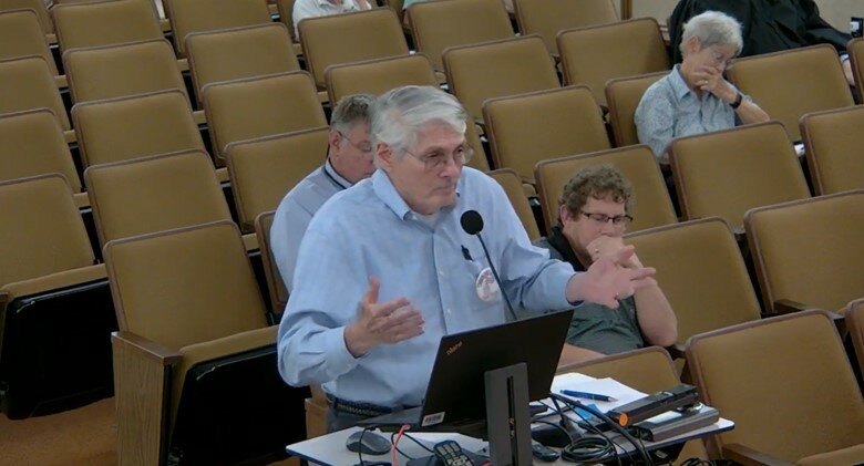 Fairhope resident Lou Campomenosi, president of the Common Sense Campaign TEA Party, speak to the Fairhope City Council during the public participation portion of the city council meeting, May 22, 2023.
