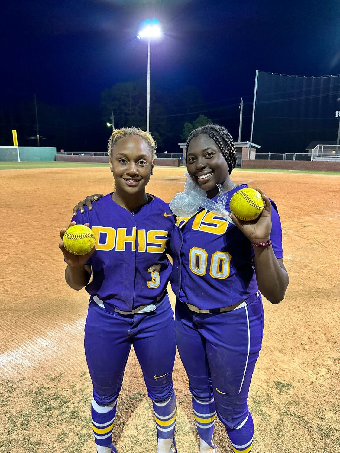 Daphne freshman Abby Johnson and sophomore Victoria Moten show off their home run balls from the Trojans’ April 25 contest against Faith Academy. The pair represented Daphne on the Class 7A first-team all-state as awarded by the Alabama Sports Writers Association.
