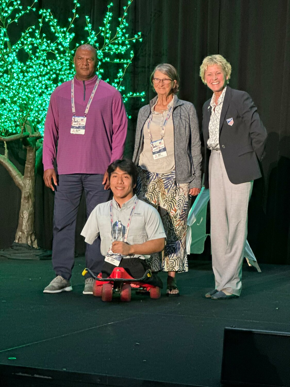 Guntersville’s Gabe Marsh (center) was presented the National Spirit of Sport Award on Wednesday, June 28, at the 104th NFHS Summer Meeting in Seattle. Pictured with him, from left, are AHSAA Executive Director Alvin Briggs, his mother Ann Marsh and NFHS Executive Director Karissa Niehoff.