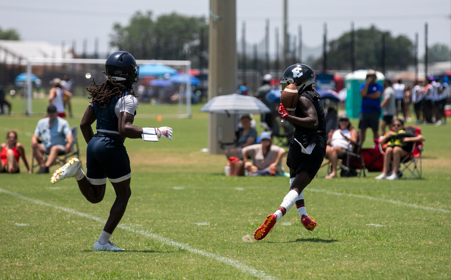 Elberta sophomore Adrian Billups reaches back to secure a catch and scamper in for a touchdown during the Warriors’ first-round bracket game against the Gulf Shores Dolphins on Thursday, June 29, at the Foley Sports Tourism Complex as part of the Lions’ 7-on-7 Showdown.