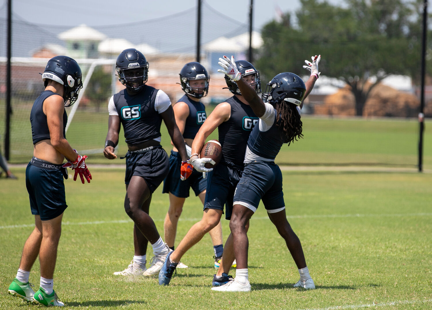 Ronnie Royal celebrates a touchdown with his Gulf Shores teammates during the Dolphins’ pool play contest against Saraland at the Foley Sports Tourism Complex last Thursday, June 29, as part of the Foley 7-on-7 Showdown. Royal said this year’s team has its sights set on replicating last year’s success that saw the school’s first state quarterfinal berth.