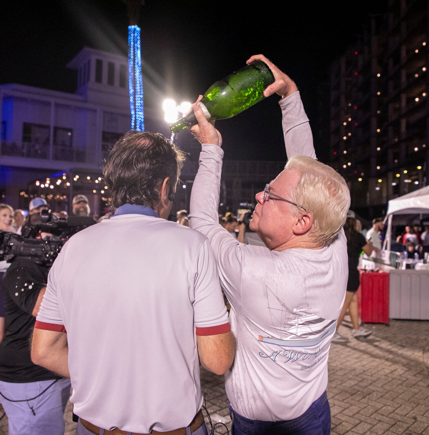 After host Jim Cox shared some of his champagne with the owner of A Work of Art last year, Art Favre repaid the favor after his boat claimed the Blue Marlin Grand Championship on Saturday, July 15, at The Wharf.