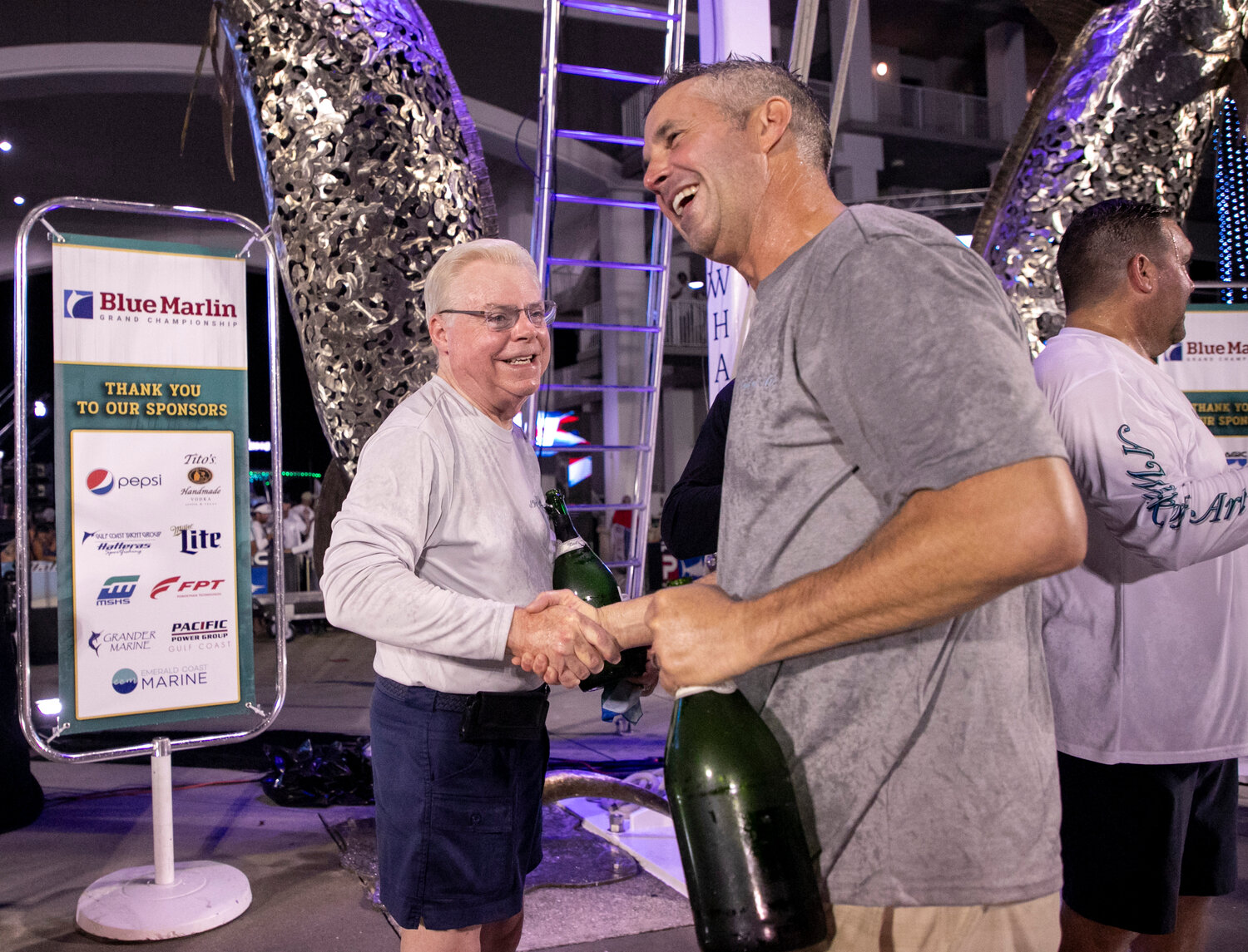 Owner Art Favre and captain Jason Buck share an embrace after their team won the 11th-annual Blue Marlin Grand Championship at The Wharf. A Work of Art became the first boat to win the tournament multiple times after it won the first competition in 2012.