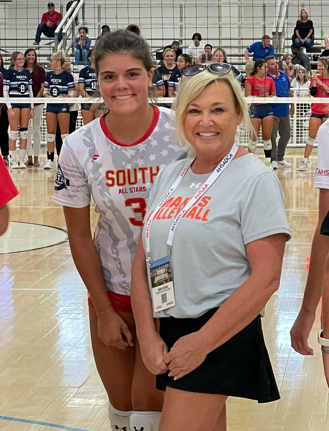 Orange Beach head volleyball coach Karen Atkins poses for a picture with Mako rising senior Amelia Edgeworth before the volleyball contest as part of the ASHSAA’s All-Star Week in Montgomery. Edgeworth collected 4 kills and 3 digs to help the South All-Stars post a 3-1 win that cut into the North All-Stars’ all-time lead in the series to 15-10.