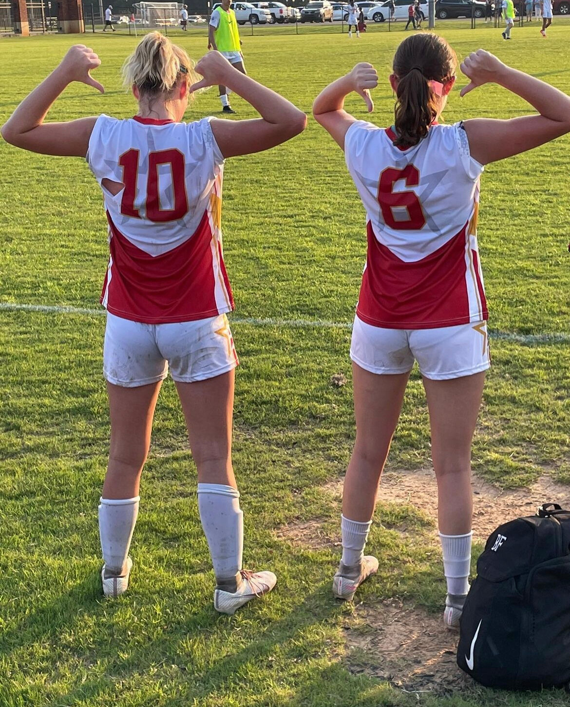 Foley’s Allie Fussell (10) and Robertsdale’s Emily Smith (6) show off their All-Star threads after the North-South soccer classic in Montgomery on Wednesday, July 19. The pair both play club soccer for Baldwin Rush.