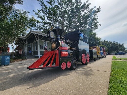 You can take a free ride on the Charles Ebert Jr. Express in Heritage Park. The train travels a route around Heritage Park and along the Perry Wilbourne Rose Trail. The route takes about 12 minutes to complete.