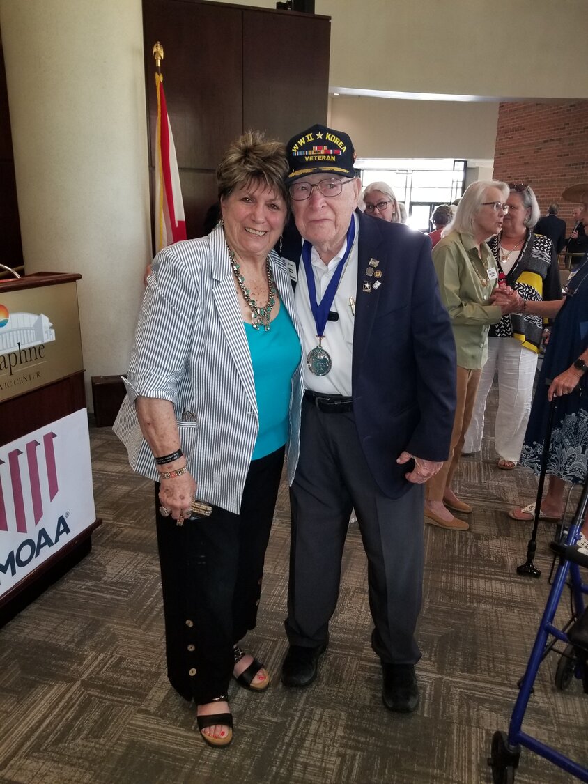 Gail Joyce and WWII Veteran Chester Feagin at the MOAA luncheon on July 27. The organization produces brochures and conducts webinars on end-of-life issues.