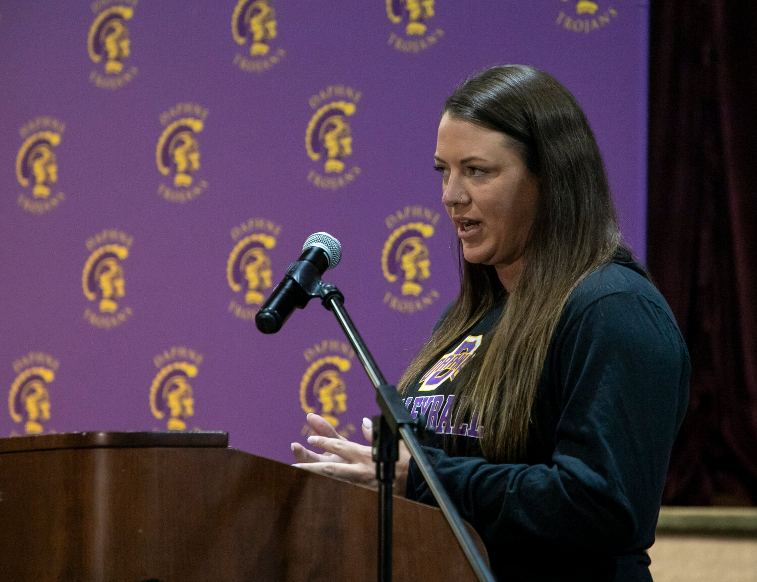 Daphne head coach Casey Craig responds to a question during Monday’s Volleyball Media Day at Trojan Hall. While only three starters return from last year’s team, Craig said a talented crop of underclassmen are ready to take the floor.