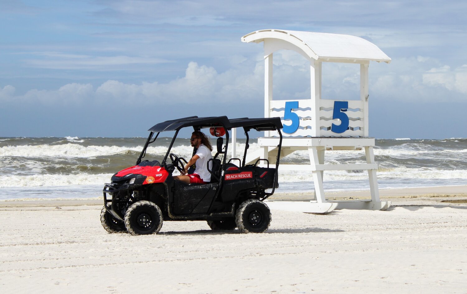 Gulf Shores lifeguard patrols the beach on a double red flag day. A double red flag signifies the water is closed.
