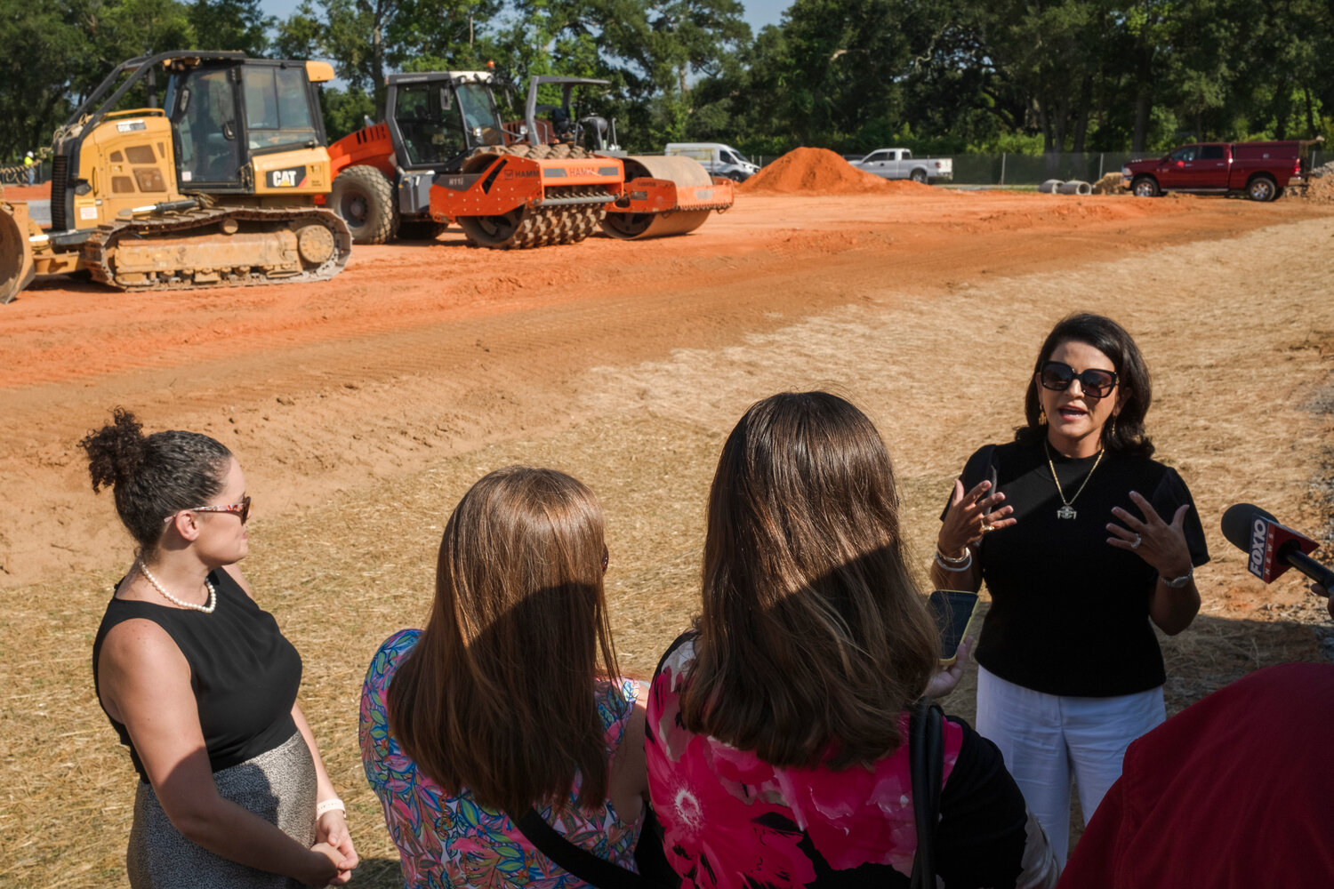 Stephanie Bryan, chairman and CEO of the Poarch Band of Creek Indians, speaks to reporters following the ground breaking for the International Residence Hall on Tuesday.