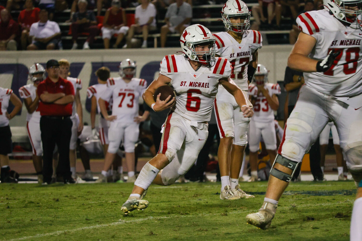 St. Michael sophomore Nick Russo eyes open field on a carry Thursday night at the Gulf Shores Sportsplex during the Cardinals’ first game of the season.