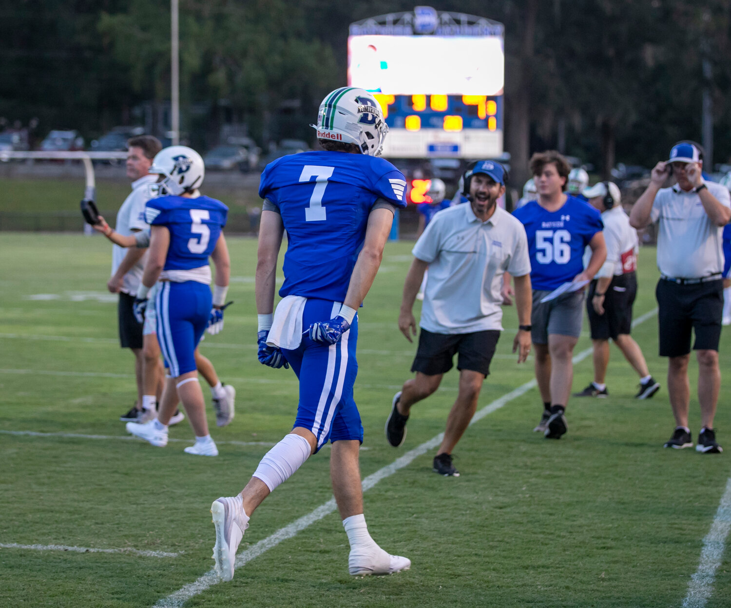 Bayside Academy senior Tait Moore returns to the sideline and is greeted by head coach Barrett Trotter after his first-quarter receiving touchdown against Elberta in the Admirals’ regular-season opener Friday night at home.
