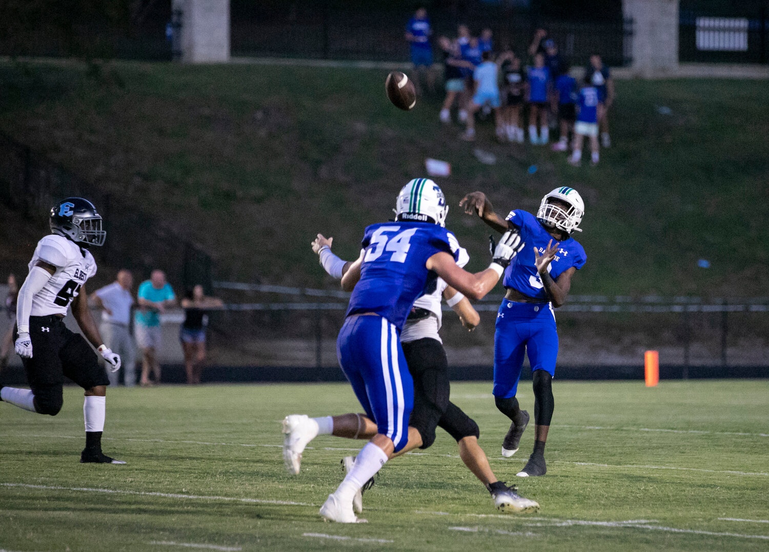 Admiral quarterback Samuel Dunn launches a throw downfield during his first start of his sophomore season at Bayside Academy Friday night at Freedom Field in Daphne. Dunn threw three touchdown passes to help the Admirals start the season with a 33-7 win over the Elberta Warriors.