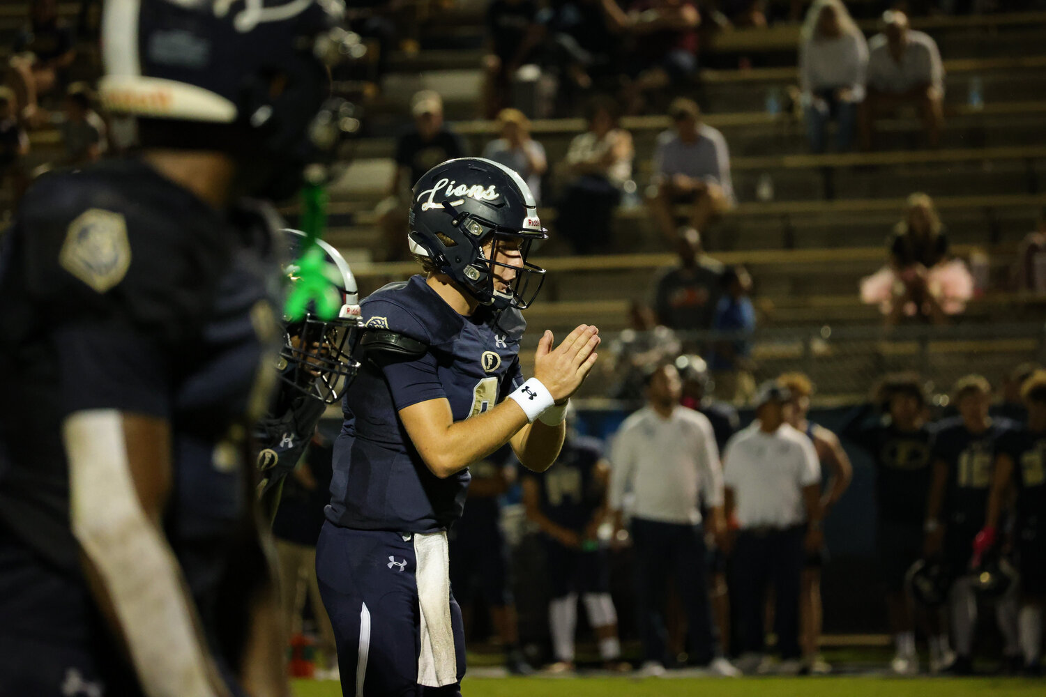 Foley quarterback Nelson Thompson clapping his hands to signal the center players to snap the ball Sep. 2 at the Ivan Jones Stadium in Foley.
