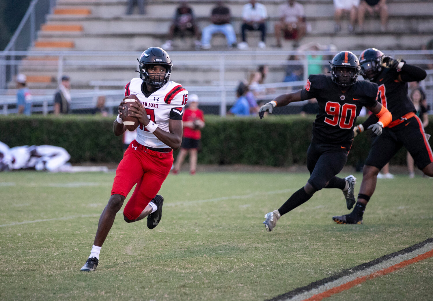 Toro sophomore quarterback Aaden Shamburger rolls out of the pocket during the first half of Spanish Fort’s Class 6A Region 1 game against the Baldwin County Tigers on the road Friday, Sept. 8. Shamburger opened the scoring with a 2-yard touchdown rush just before halftime.