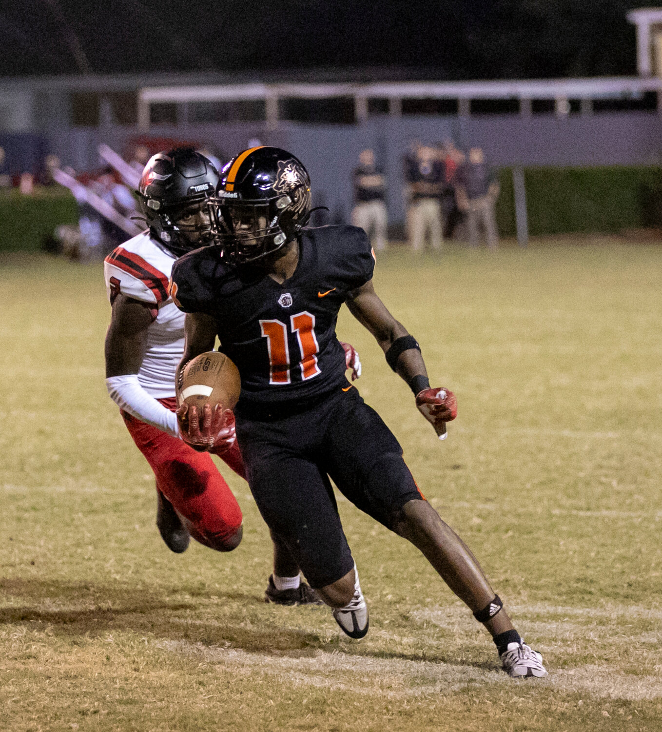 Baldwin County junior Trecarious French turns the corner after a second-half catch Friday night on Mitchell Field at Lyle Underwood Stadium as part of the Tigers’ game against the Spanish Fort Toros. French later came up with a reception on fourth down to extend Baldwin County’s final drive of the game.