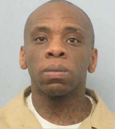 Christopher Bates is described as a 5’4” Black male weighing 144 lbs. He has a neck tattoo and gold teeth.