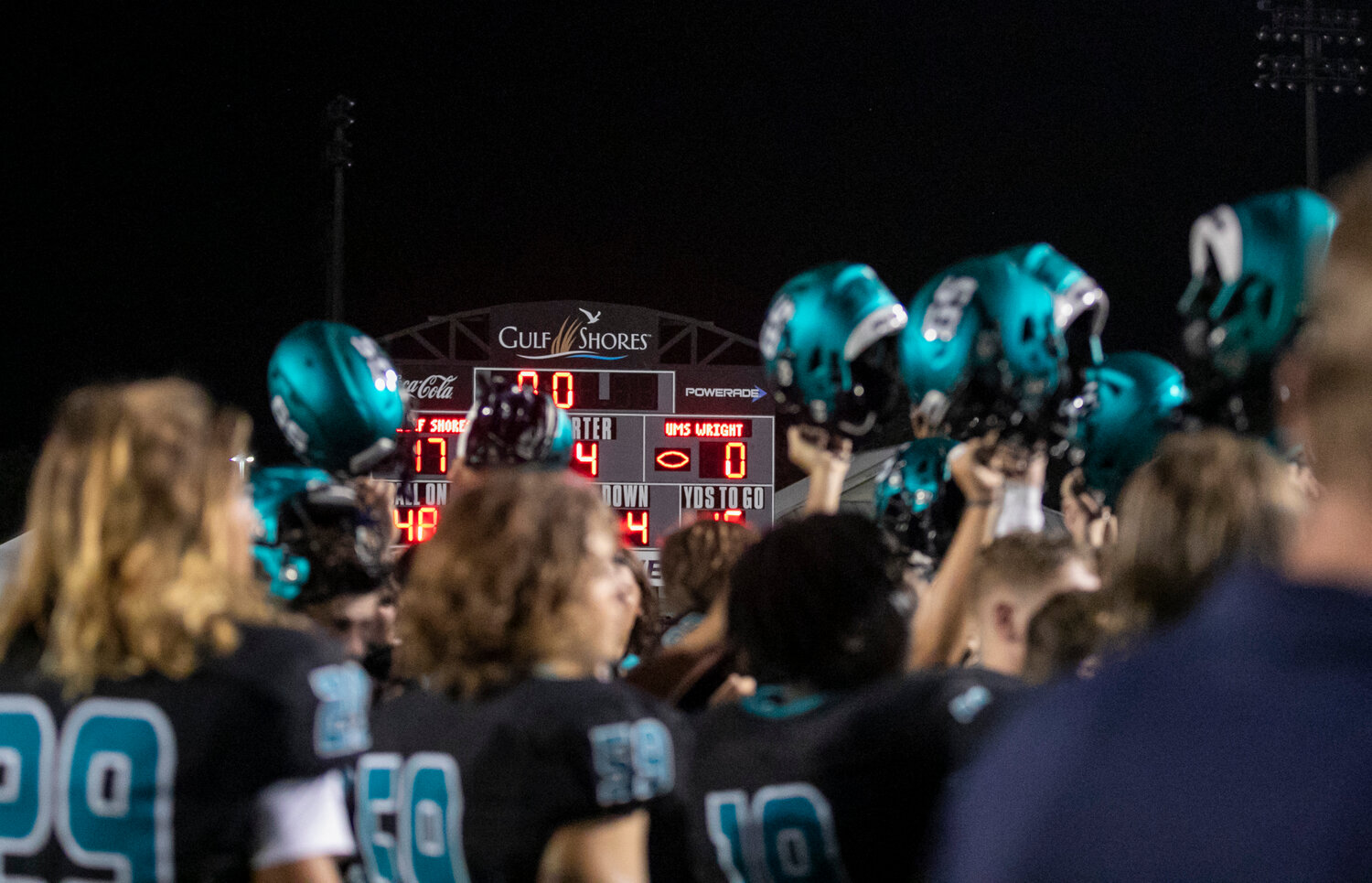 The Gulf Shores Dolphins celebrate the program’s first victory over the UMS-Wright Bulldogs on Friday, Sept. 15, by a 17-0 margin within Class 5A Region 1. It also registered a second straight win over a ranked opponent which the team had also never done.