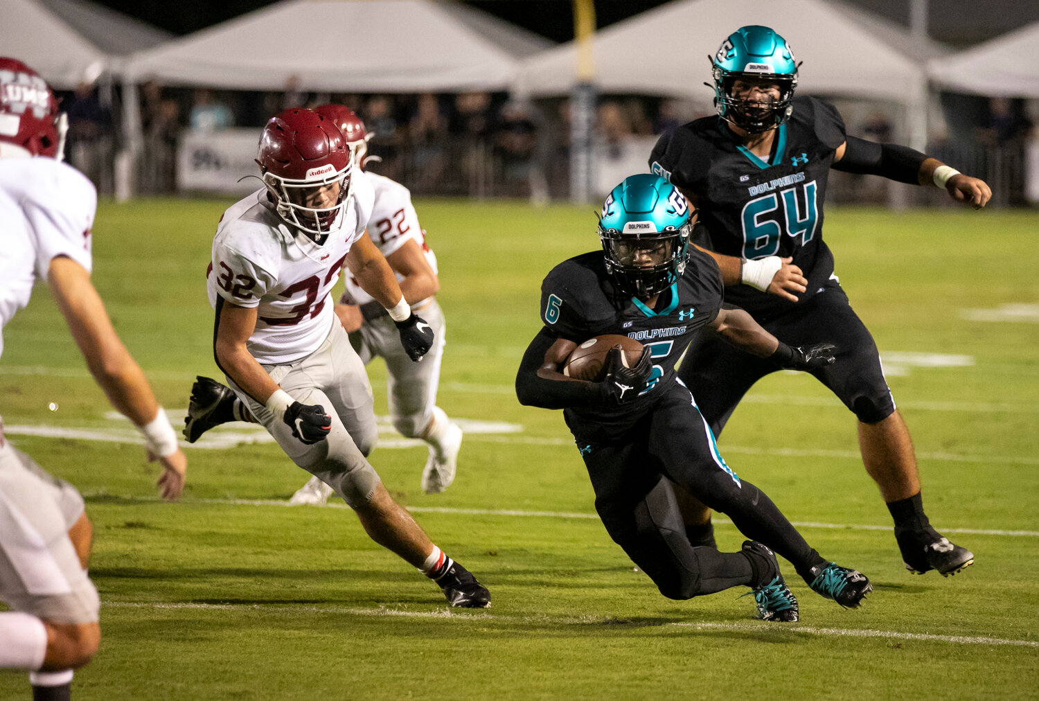 Kolin Wilson (6) makes a move in the second level during the Dolphins’ Class 5A Region 1 contest against the UMS-Wright Bulldogs at home on Friday night. Wilson finished with 46 rushing yards and a 1-yard touchdown run that helped Gulf Shores earn its first win in program history over UMS-Wright 17-0.