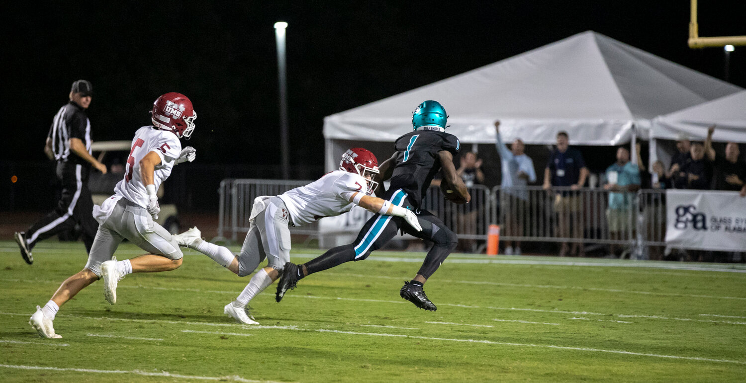 Dolphin senior Braden Jackson hauls in a 44-yard reception as part of Gulf Shores’ 17-0 win over UMS-Wright in Class 5A Region 1 action Friday night at Mickey Miller Blackwell Stadium. It was the Dolphins’ first victory over the Bulldogs in program history and served as a second straight win over a ranked opponent which also marked a first in team history.