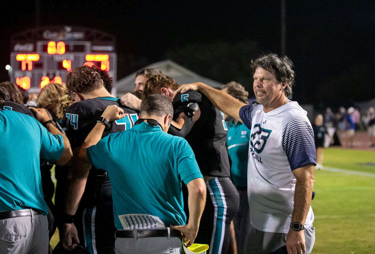 Dolphin defensive coordinator Brian VanGorder (far right) celebrates with his team after a 17-0 win over the UMS-Wright Bulldogs on Friday, Sept. 15, at Mickey Miller Blackwell Stadium at the Gulf Shores Sportsplex. It served as the Dolphins’ second shutout of the season and marked the first season with two shutouts since 2021, which also featured VanGorder as defensive coordinator.