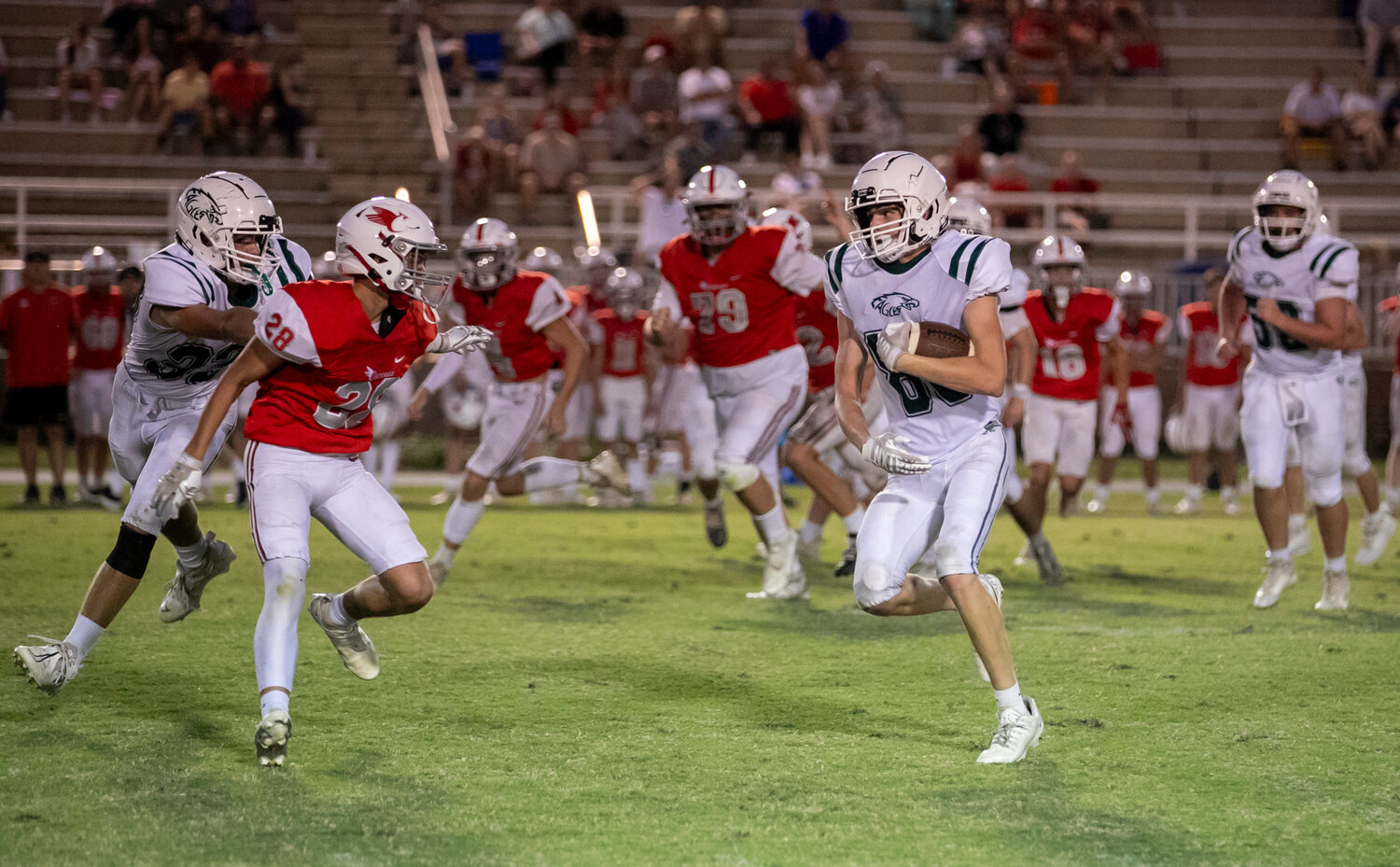 Eagle sophomore Ryland Bosarge runs after a second-half catch during Bayshore Christian’s JV game against the St. Michael Cardinals in Fairhope on Monday, Sept. 25.