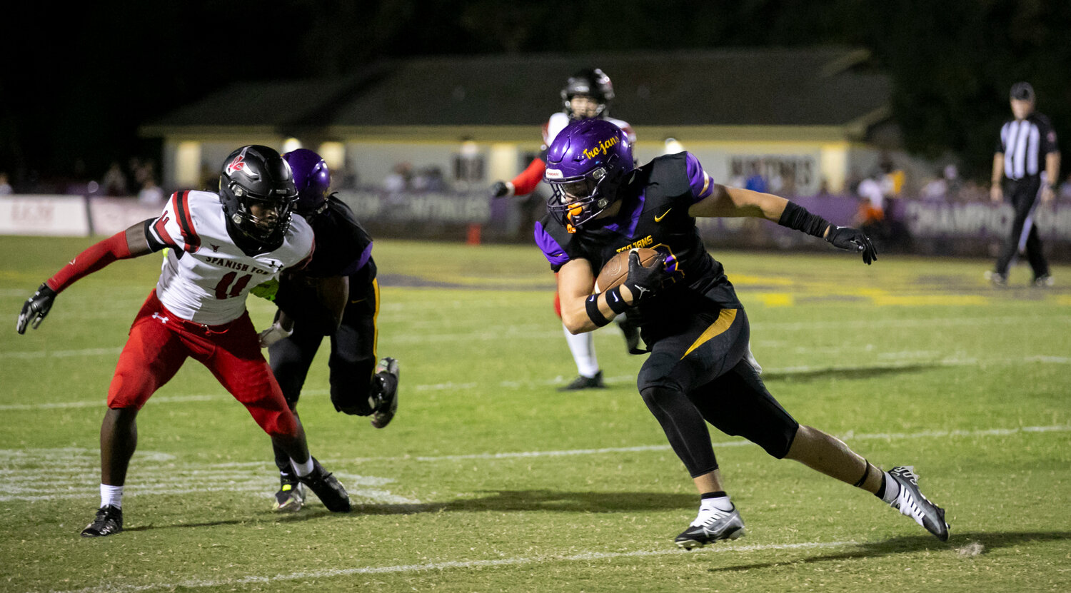 Hayden McLaurin chews up yards after the catch and bears down on a Spanish Fort defender after a first-half catch during Daphne’s rivalry game against the Toros at Jubilee Stadium on Friday, Sept. 29. McLaurin found himself on the end of a 6-yard touchdown pass as the Trojans scored on all four of their first-half possessions.