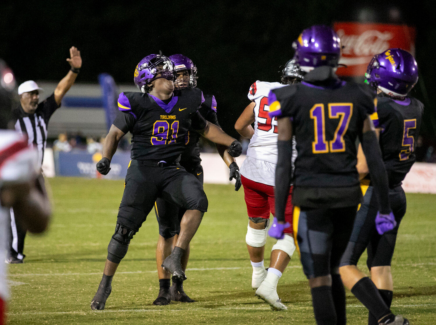 Daphne junior Marquaes Lambert (91) celebrates a big stop in the first quarter of rivalry action against the Spanish Fort Toros on Friday, Sept. 29, at Jubilee Stadium. The Trojans held Spanish Fort to 7 first-half points in the 12th installment of the Eastern Shore rivalry.