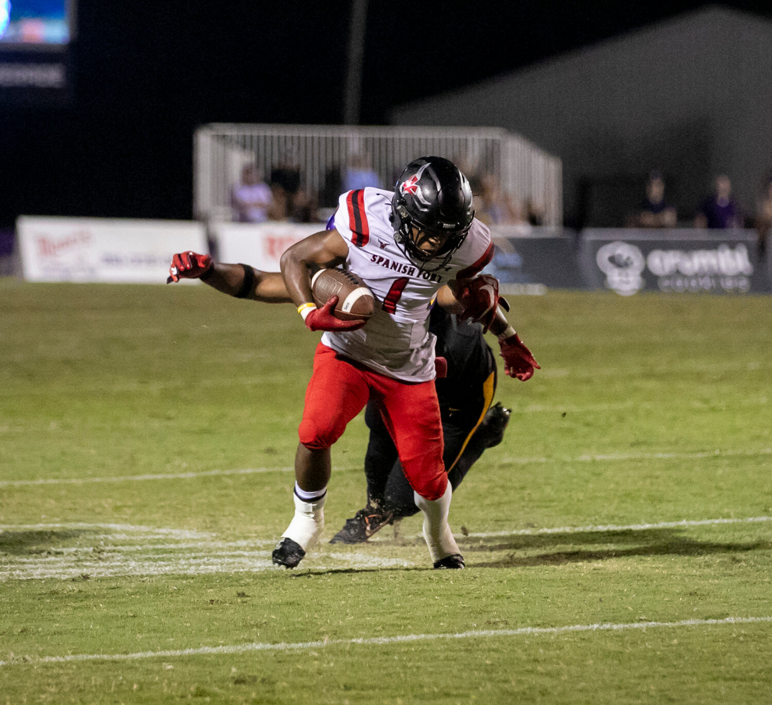 Spanish Fort junior Nehemiah Hixon (1) sheds a Daphne defender after securing a catch on Friday, Sept. 29, during the Toros’ non-region game against the Trojans on the road. At the end of the season, Hixon registered 1,202 all-purpose yards with 7 total touchdowns.
