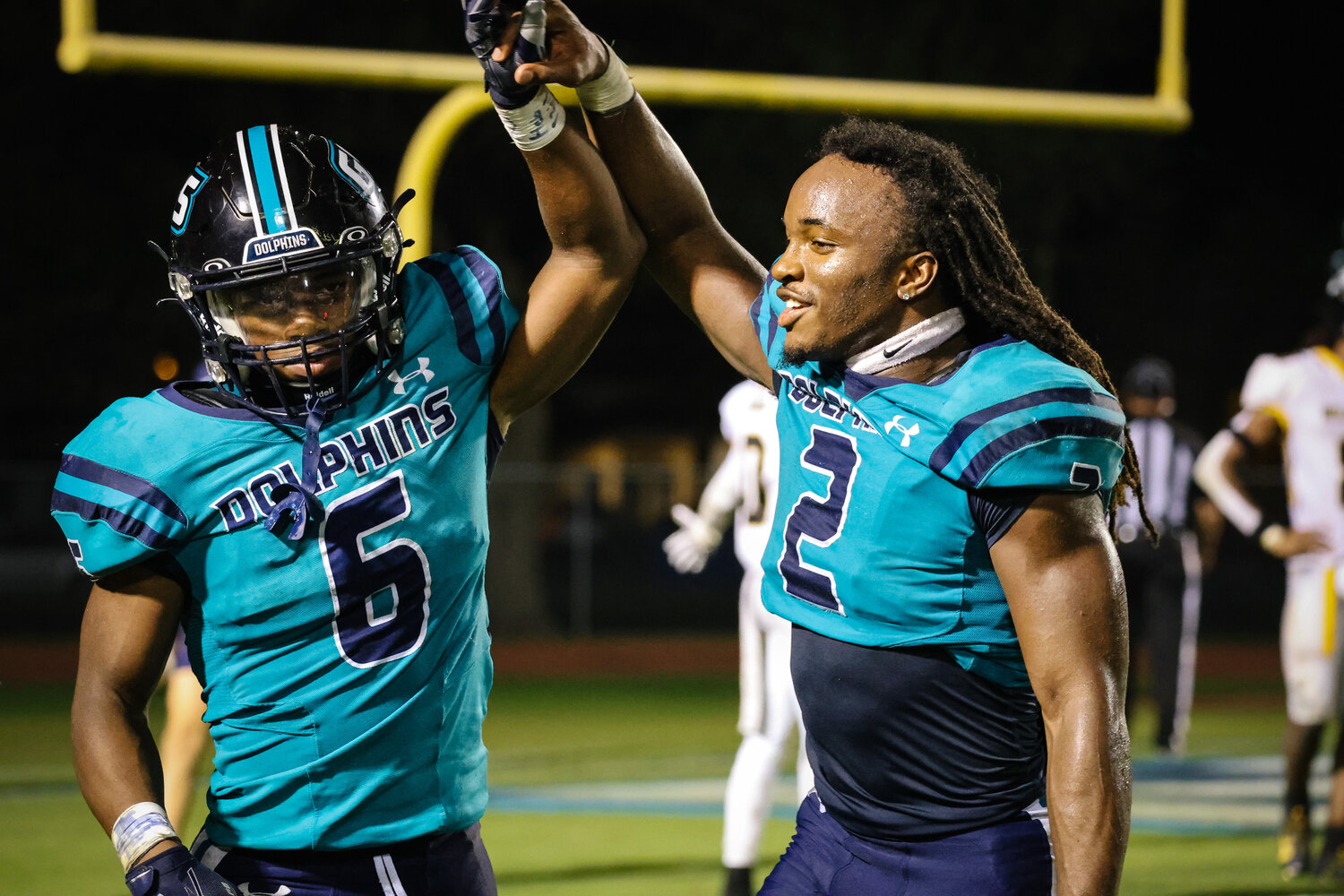 Junior Kolin Wilson and senior Ronnie Royal celebrate Wilson's second touchdown of the night on Friday, Oct. 6, at the Gulf Shores Sportsplex as part of the Dolphins’ 45-13 win over Williamson. Both athletes registered two touchdowns each to help extend Gulf Shores’ season-opening win streak to seven games.