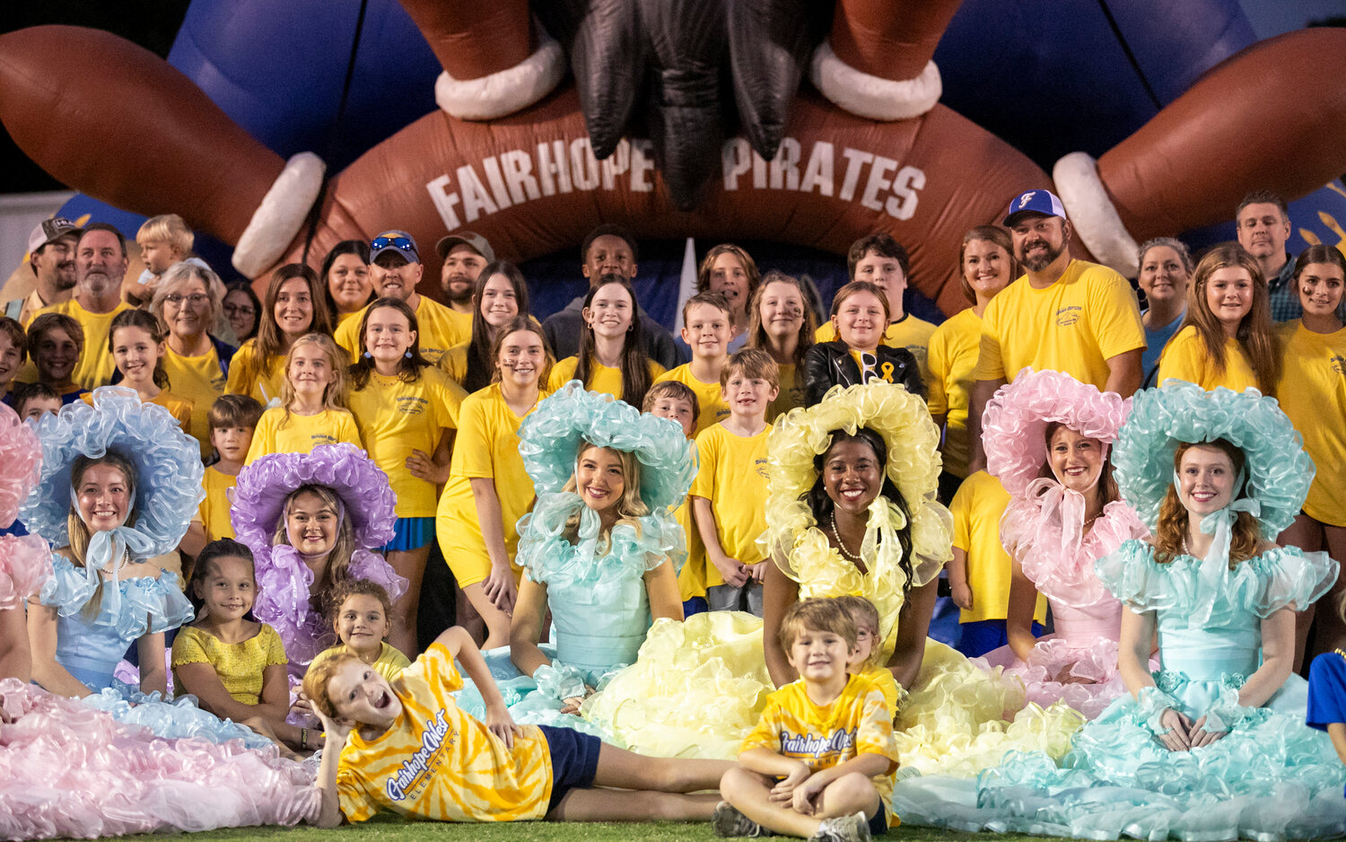 The 10th-annual Spina Bifida Awareness Game gathered for a photo in front of the Pirate inflatable Friday night at Fairhope Municipal Stadium. The event surpassed its fundraising goal and donated $10,500 to help families local and statewide with medical and non-medical expenses.