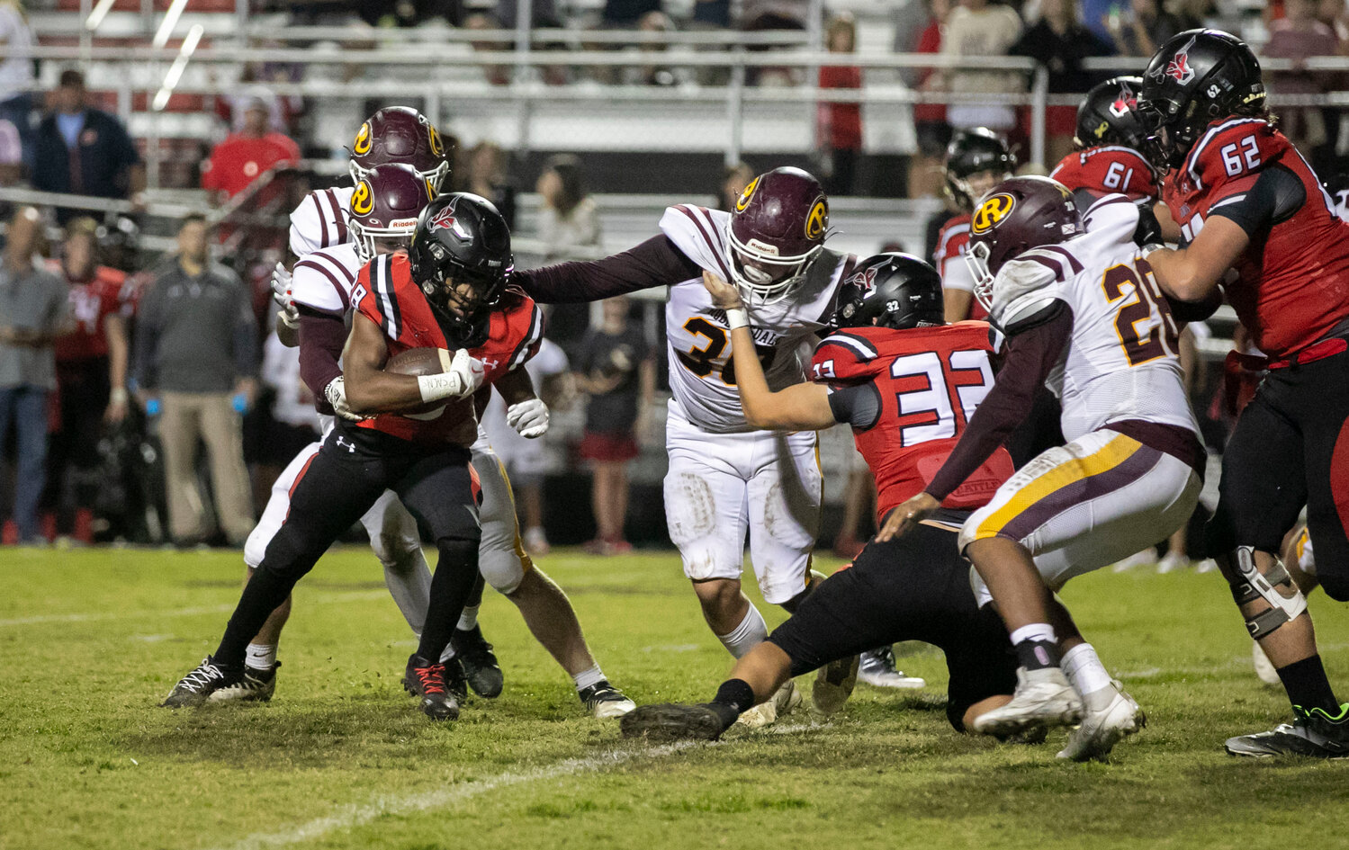 Robertsdale freshman Hunter Williams (46), senior Camden Johnson (30) and sophomore Aaron Coronilla (28) converge for a tackle of Spanish Fort sophomore Justin Vines (28) in the fourth quarter of Friday’s Class 6A Region 1 game between the Golden Bears and Toros. Spanish Fort emerged with a 45-0 win.