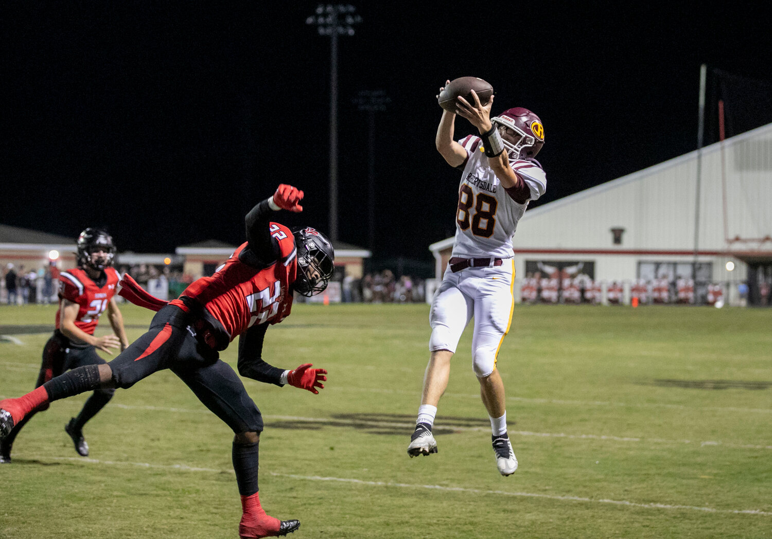 Robertsdale junior Bryson Gier makes a leaping catch near the sideline in the fourth quarter of the Golden Bears’ away region game against Spanish Fort Friday night. Grier followed up this 21-yard catch with a 30-yard reception to help Robertsdale rally on its final drive.
