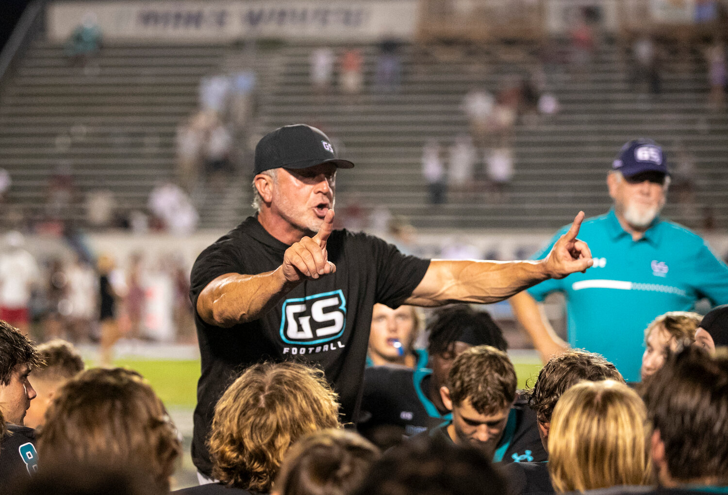 Gulf Shores head football coach Mark Hudspeth congratulates the Dolphins for recording the program’s first victory over the UMS-Wright Bulldogs after a 17-0 decision at Mickey Miller Blackwell Stadium on Sept. 15. On Friday night, Gulf Shores wrapped up its first regular-season region title with a 42-12 win over No. 10 Vigor.