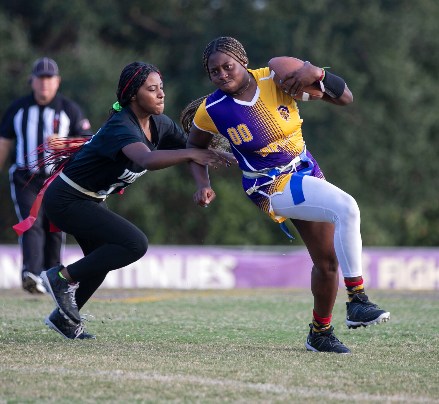 Daphne junior Vic Moten maneuvers around an MGM tackler on a first-half carry during the Trojans’ playoff game against the Vikings at Jubilee Stadium on Monday, Oct. 30. The Alabama softball commit delivered the go-ahead score in the nightcap to help Daphne take down Alma-Bryant 13-7 and advance to the Elite Eight state tournament in its first season.