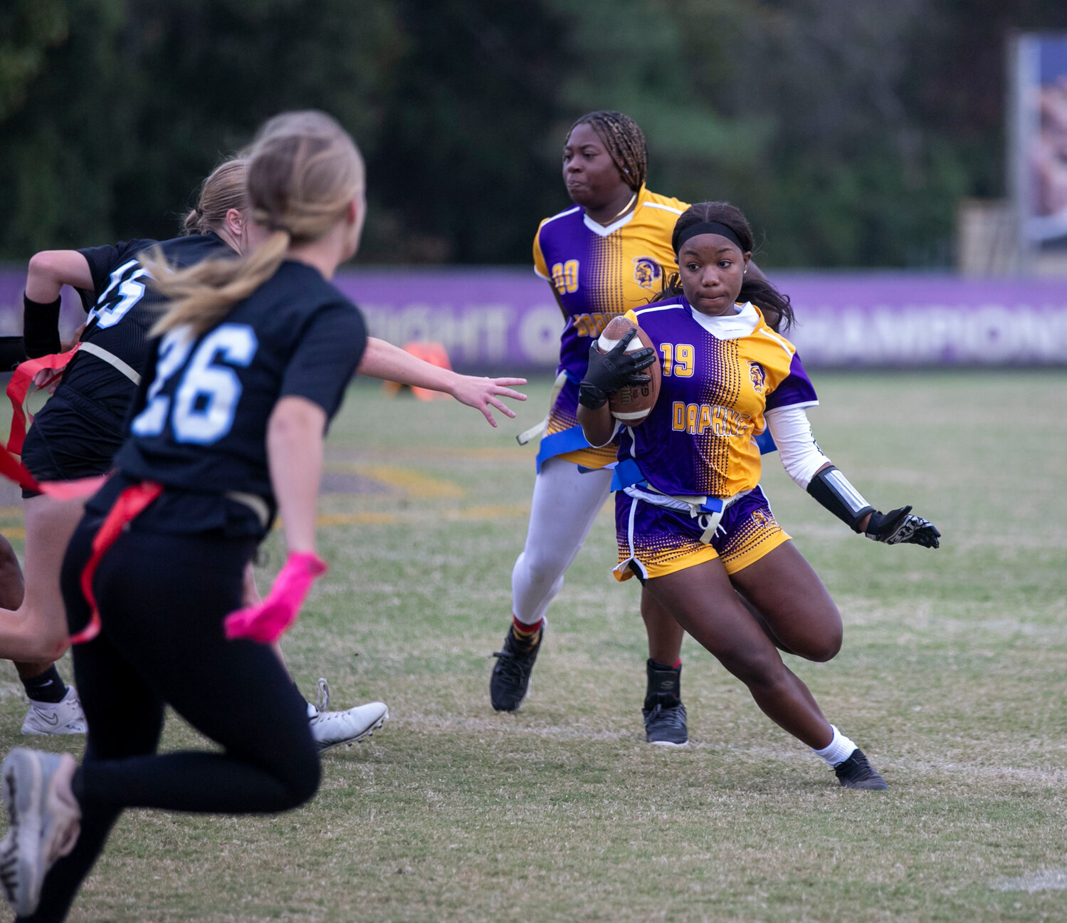 Sophomore Haile Moorer picks up extra yards on a first-half carry as part of Daphne’s 20-0 win over the MGM Vikings to open the Class 6A-7A Area 1-2 Tournament at Jubilee Stadium on Monday, Oct. 30. That win, paired with a 13-7 decision in the nightcap, punched the Trojans’ ticket to the state tournament in their inaugural season.