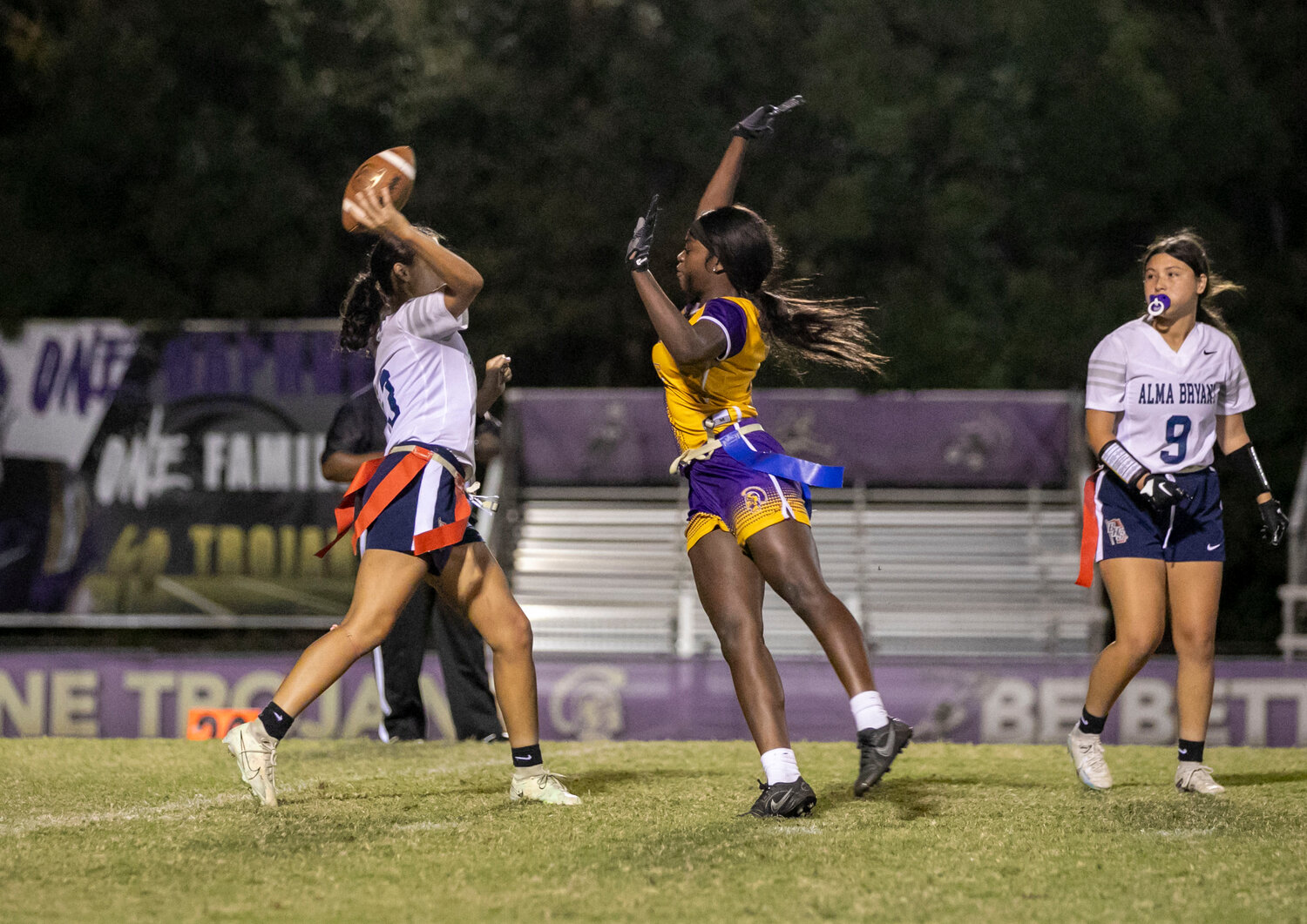 Daphne junior Tiyana Richardson applies pressure on the Alma-Bryant quarterback during Monday’s regional championship game between the Trojans and Hurricanes at Jubilee Stadium. The Daphne defense came up with big stops down the stretch to help lock in a 13-7 victory and a berth to the state tournament.