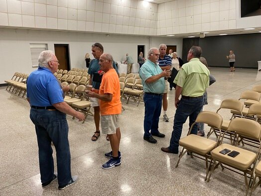 Foley city officials talk to residents at a recent meeting to discuss city services and area needs.