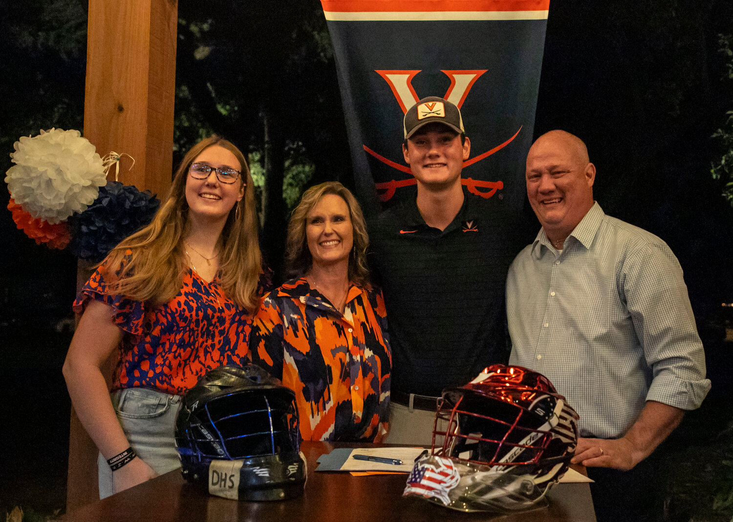 The Capstraw family poses for a photo after Troy cemented his commitment to the Virginia Cavalier lacrosse program during a signing ceremony on Wednesday, Nov. 8, in Daphne.