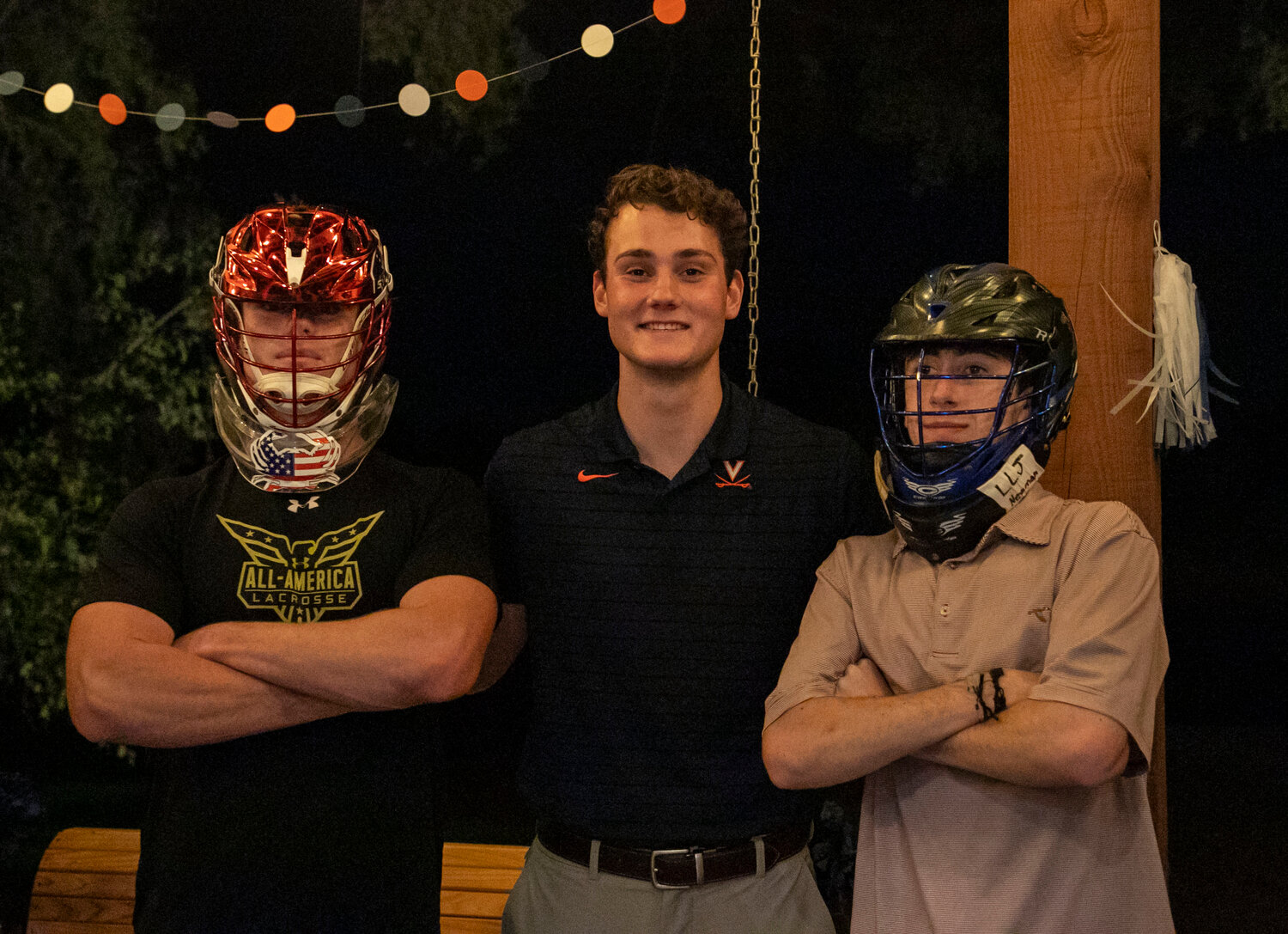 Fairhope seniors Brockton Norris and Lane Watson celebrated the signing of Daphne senior Troy Capstraw Wednesday night after the All-American goalie penned his National Letter of Intent to join the Virginia Cavaliers.