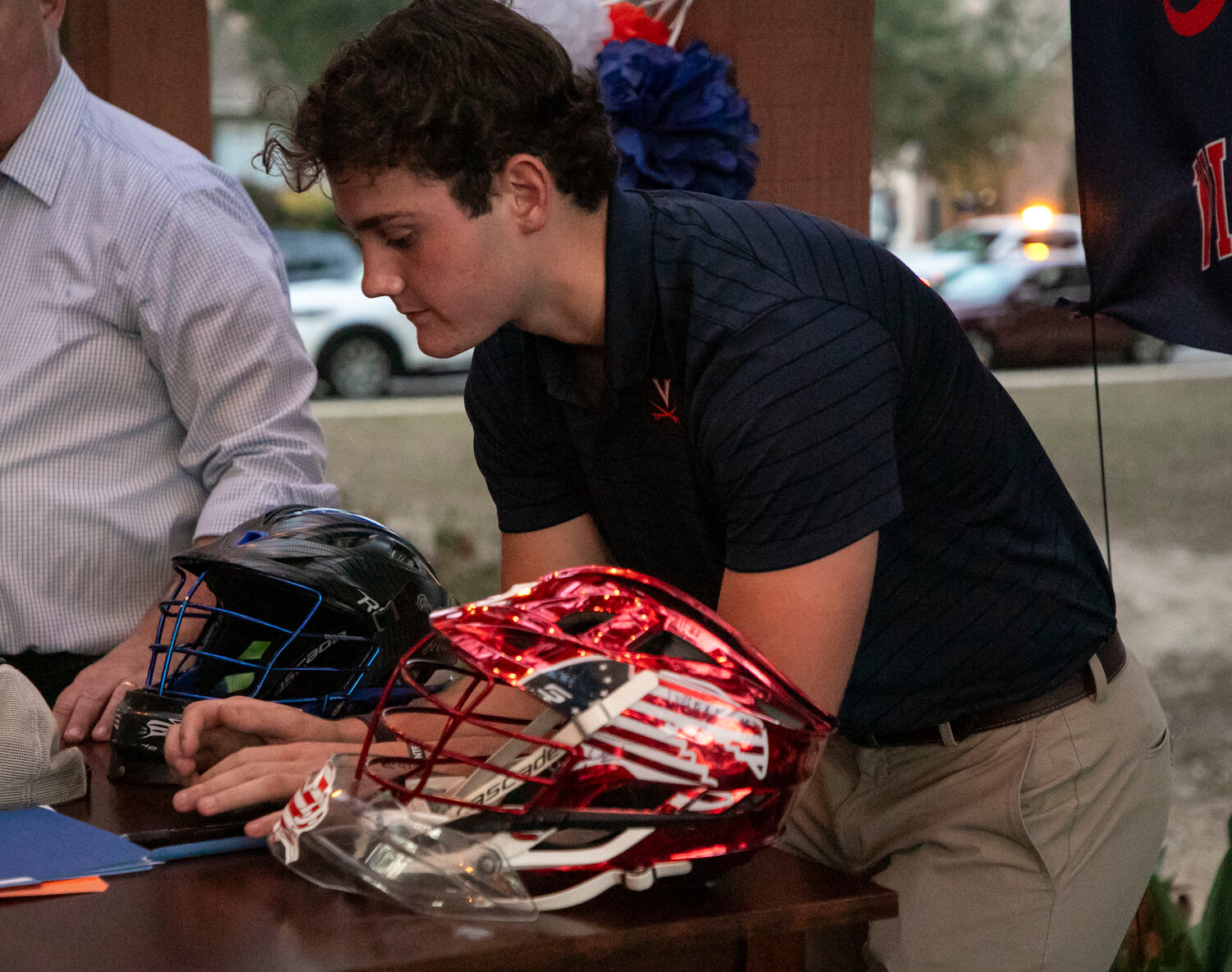 Daphne senior Troy Capstraw prepares for his signing ceremony on Wednesday, Nov. 8, where he put pen to paper and locked in his commitment to play lacrosse at Virginia. Also a member of National Honor Society and the Daphne Junior City Council, Capstraw is also a state-qualified diver for the Trojans.