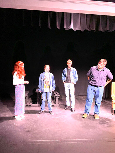 Cast members from "The Outsider" run lines at an Oct. 9 dress rehearsal.