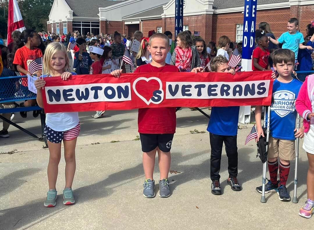 Students at Larry J. Newton Elementary School welcome veterans with handmade signs at the annual Veteran's Day Parade on Nov. 9.