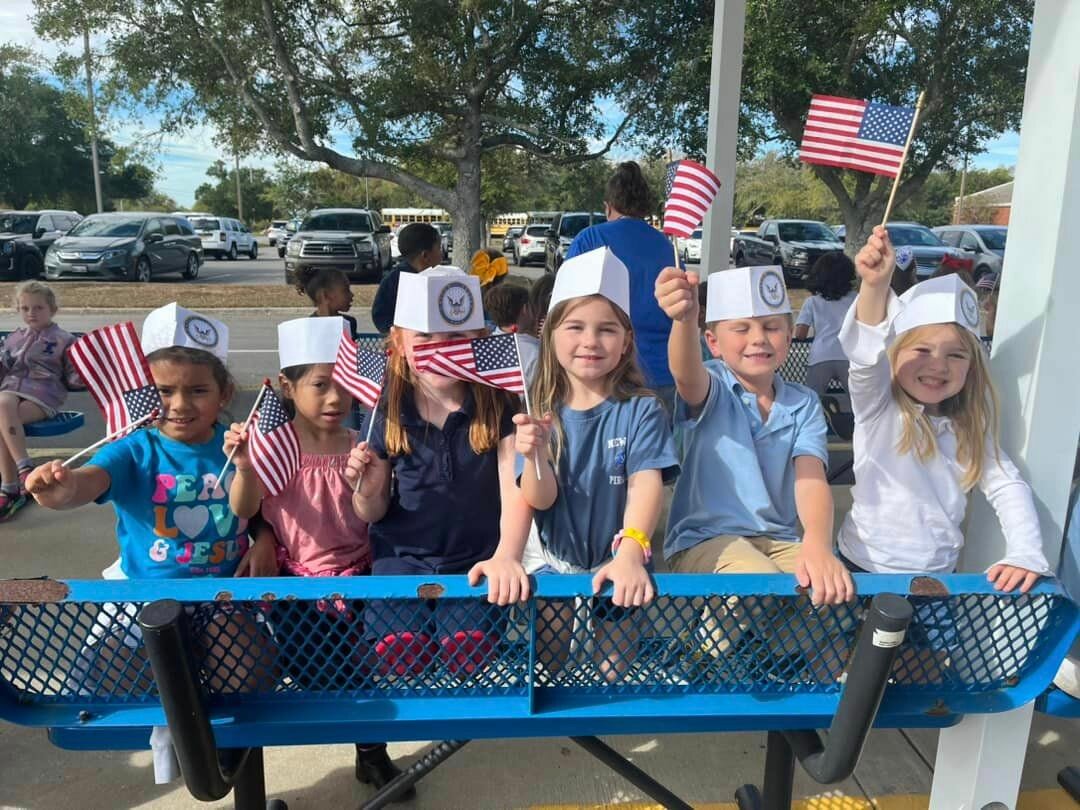 Students at Larry J. Newton Elementary School welcome veterans with handmade signs at the annual Veteran's Day Parade on Nov. 9.